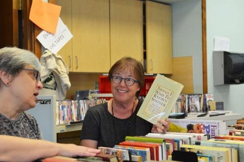 Volunteer Debi Ady (left) with Cathy Jo Clawson at the Friends of the Library book sale Sept. 29 where hundreds of donated books were sold to support the Key Center branch of the Pierce County Library System. Photo: Lisa Bryan, KP News