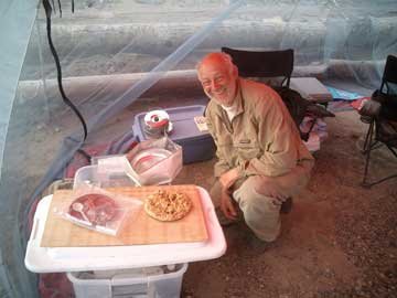 Don Hornbeck was one of the trip’s cooks, and is pictured  here with the evening staple meal, bannock (fried bread).  Photo courtesy Don Hornbeck