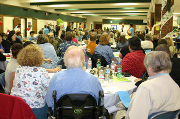The CIP dinner auction is packed with about 250 supporters.  Photo by Hugh McMillan