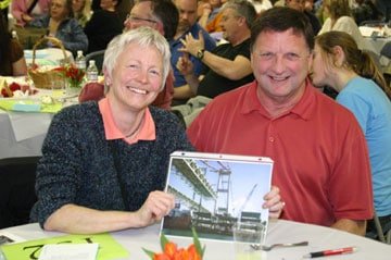 Robin Peterson and Bob Scott of Scott Realty share  a double visit to the top of the tower of the new Tacoma  Narrows bridge after a tough bidding battle for the trip.  Photo by Hugh McMillan