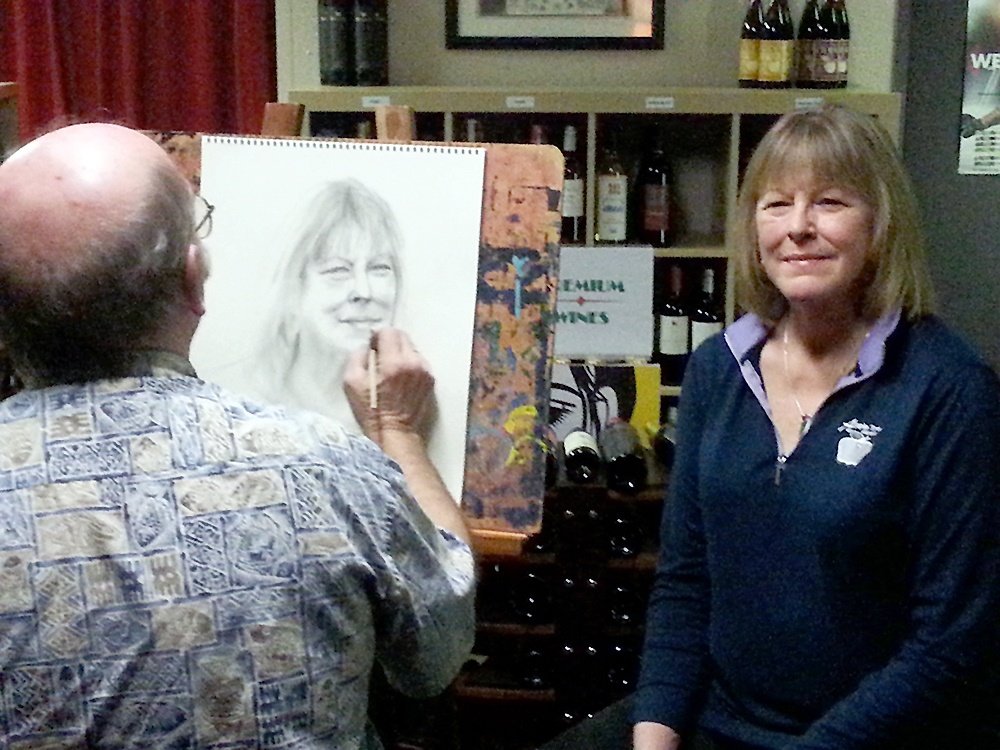 Photo: Don Swensen Key Peninsula Middle School science and art teacher Chris Bronstad demonstrates his skill at Blend Wine Shop in Key Center Nov. 4 during as exhibit of his artwork. His collection will be on display until early December. Blend co-owner Molly Swensen said about her portrait, “I forgot how good I look.” SCH-I605, 4mm, f/2.6, ISO 800