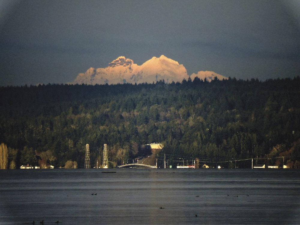 The Three Fingers Mountain in the Cascades is seen here in an extreme telephoto shot taken in January. The mountain is 6,859 feet tall and located in Snohomish County near Granite Falls. The name refers to the mountain's three summits. Photo: Ron Cameron