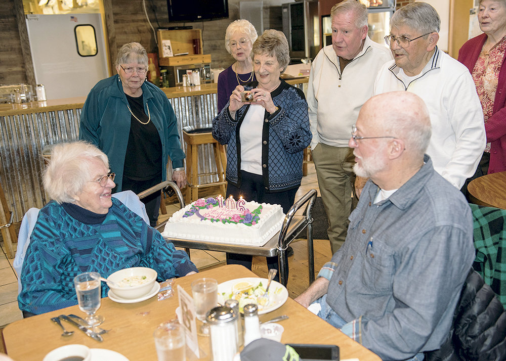 Dorothy Lusby Bouvia, former English teacher at Vaughn and Peninsula high schools, celebrates her 106th birthday with son, Brian, lower right; and former students Norma (Stokke) Hitter, Janet (Gourlie) Hook, Dick Brentin, Francis Pinchbeck and Carol (Ingham) Hughes. When asked how she was feeling these days, Bouvia said, “Very good. I could dance a jig!” Photo: Ed Johnson, KP News