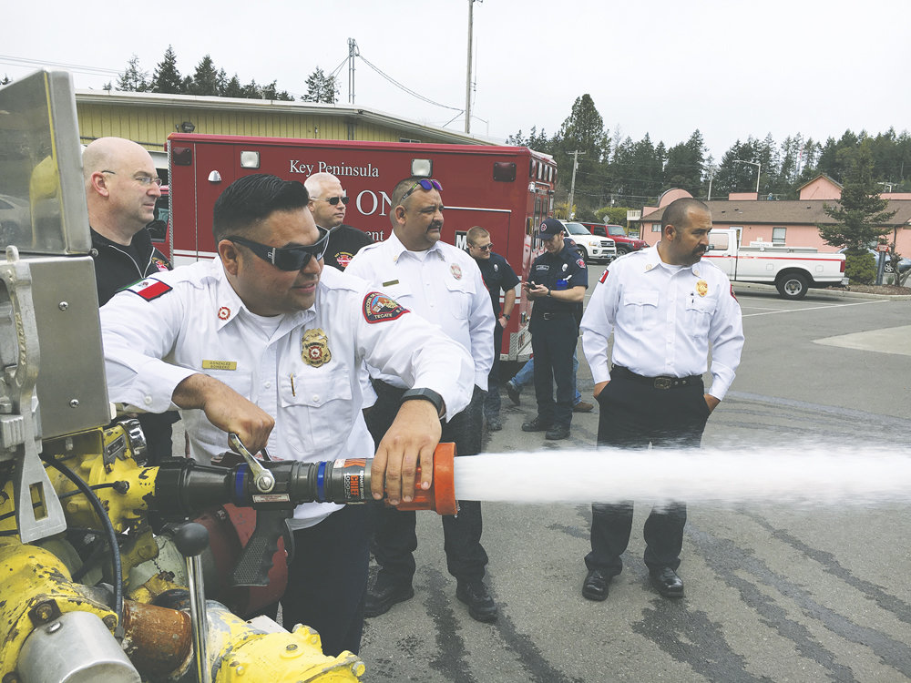 Mexican firefighters Christian Gonzales (at nozzle), Francisco Campos (center) and Eduardo Noreiga of Tecate, Baja California, inspect the 1980 water tender donated to them by the KP fire department April 4 though Firefighters Crossing Borders. They received training on the tender and participated in a volunteer drill, fighting live fire on the car prop behind the Key Center station. “It was great getting to know them and quite inspiring to see such passion for providing much needed emergency response for their community,” said Fire Chief Guy Allen. They hit the road the next morning and, after running into snow in the Siskyous and blowing a tire in Southern California, finally arrived home April 8. Photo: Anne Nesbit