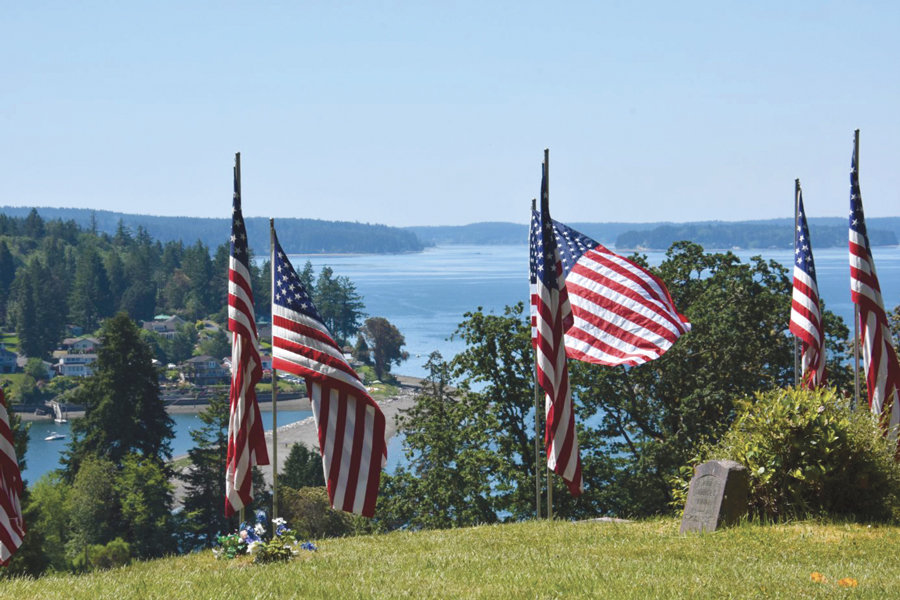 The Key Peninsula Veterans hosted its annual honor aisle at Vaughn Cemetery on Memorial Day with the largest display of flags west of the Mississippi River, according to Frank Grubaugh, past KP Veterans president. Over 330 flags were flown at the cemetery, which overlooks Vaughn Bay and Case Inlet. Photo: Don Tjossem, KP News