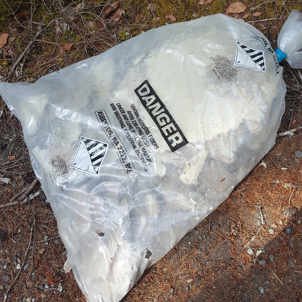 Several bags of asbestos from a demolition or renovation site were illegally dumped on 149th Street KPN near Rocky Creek in the early evening of Saturday, Aug. 19. Anyone with information about this incident can call the Pierce County Sheriff’s Department at 253-798-4722. Asbestos is a hazardous air pollutant requiring proper removal and disposal. When handled improperly, asbestos breaks down into small fibers that are easily inhaled and can cause lung cancer, asbestosis or mesothelioma. Report illegal dumping at 253-798-6000. The property owner is responsible for removing trash illegally dumped on private property or a private road but is eligible for a litter credit of up to $125 in disposal fees. Photo: Lorraine Hart