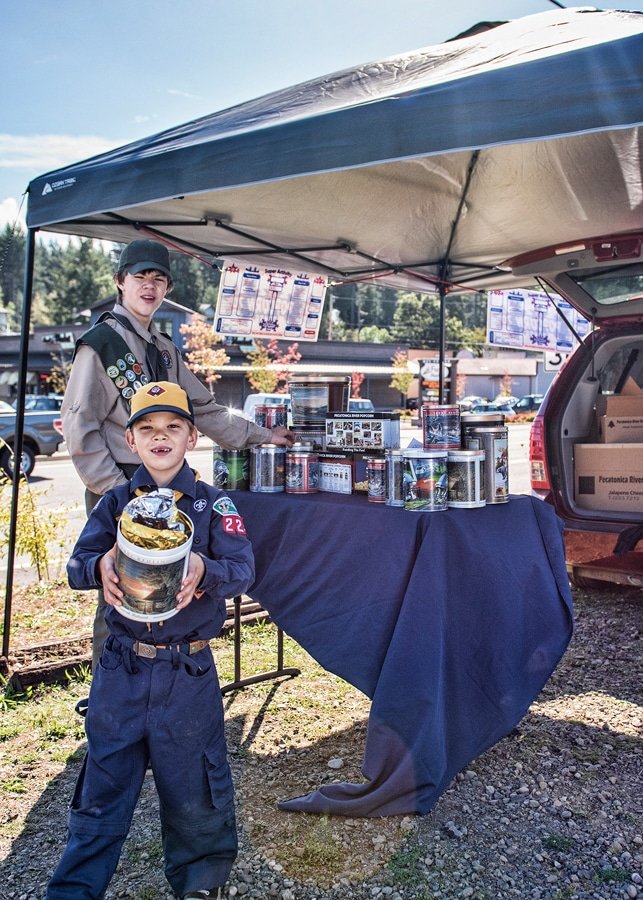 Luke and Jonah Fritsch, of Boy Scout Troop 220, sell popcorn in front of Buck’s in Key Center to raise money for their troop. Photo: Ed Johnson, KP News