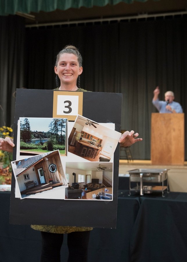 Anna Brones shows off one of the items that was auctioned at this year’s Two Waters Arts Alliance Colors of Autumn fundraiser at the Civic Center in September.  Photo: Ed Johnson, KP News