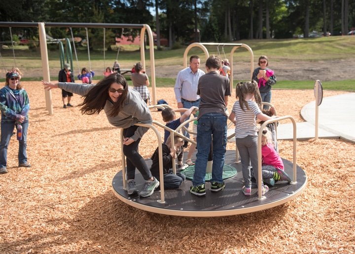 Kids (and some adults) are enjoying themselves on the playground at Gateway Park on its first official open day. A steady stream of kids and adults stop at the park through the evening. Photo: Ed Johnson, KP News