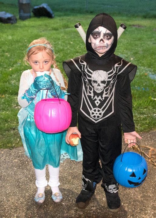 Annabelle and Aiden Hall are enjoying treats provided at the Key Pen Parks’ Halloween celebration at Gateway Park on Oct. 18. Photo: Ed Johnson, KP News