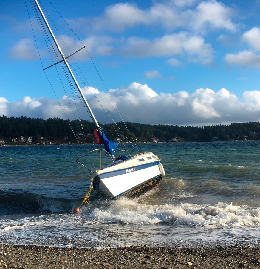 A sailboat recently beached on Purdy Spit after stormy weather. Photo: Ted Olinger, KP News