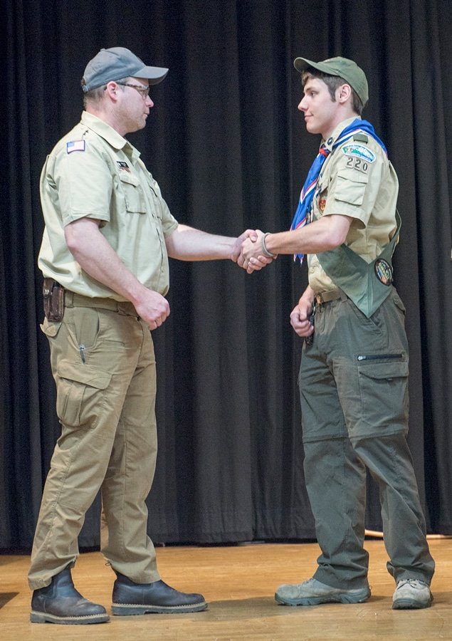Troop Committee Chair Chris Quill congratulates new Eagle Scout Nicholas Wiklund. Photo: Ed Johnson, KP News