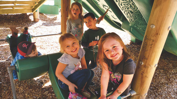 KP Co-op Preschool children at play after school at Home Park. Back from left: Mason Erwin, Elise Gingerich, Colton Kienast; front from left: Grace Maynard, Addison Phillips. Photo: Crystalann Kienast