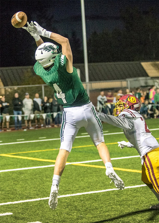 Senior Cole McVay tries to pull down a pass during the Peninsula Seahawks season opener at home Sept. 6. They lost 21-6 to the Fighting Irish of O’Dea High School from Seattle. Photo: Ed Johnson, KP News