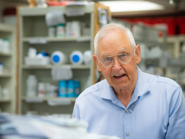 Local pharmacist Don Zimmerman's portrait was cited for showing him in the workplace while capturing his personality. Photographer Richard Miller took a first place award for his work.