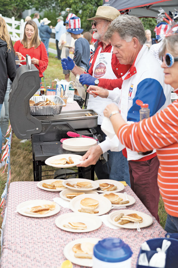 Pancake eaters at the parade. Photo: Chris Konieczny, KP News