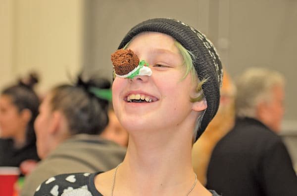 KPMS student Oliver Lund, 11, enjoys the fun at Red Barn Youth Center’s Christmas party. Photo: Lisa Bryan, KP News