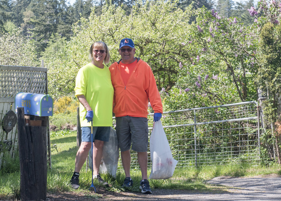 Diana and Jim Craig put their daily walk to good use picking trash along the KP Highway. Photo: Ed Johnson, KP News