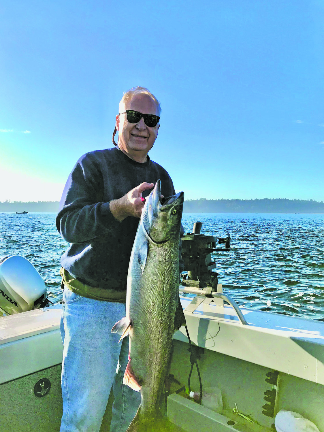 Longbranch resident Rich Hanson shows off his 15 lb. chinook salmon near Filucy Bay.