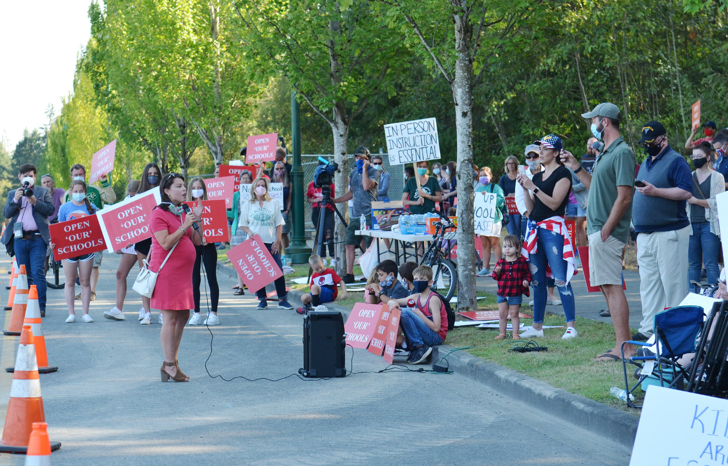 Office of Superintendent of Public Instruction candidate Maia Espinoza speaks at a rally to fully reopen schools Aug. 13 across from the construction site of Elementary No. 9 on Harbor Hill Drive in Gig Harbor.