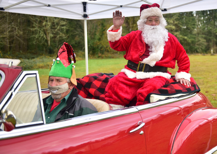 Fred Leensta takes Santa Mike Fay for a sweet ride at the LIC Kids and Christmas.