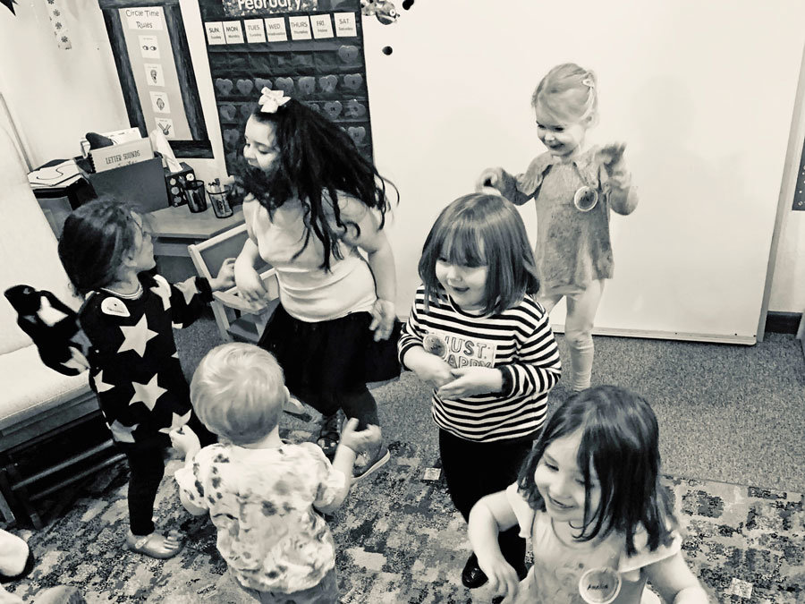 Preschool students enjoy a dance party in February 2020, before “social distancing” came along.