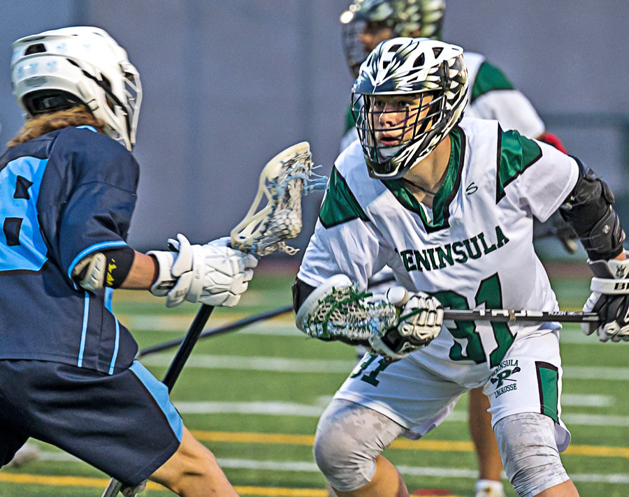 Subject of Bryan's first-place-winning story, Boden Clark faces off on lacrosse field.