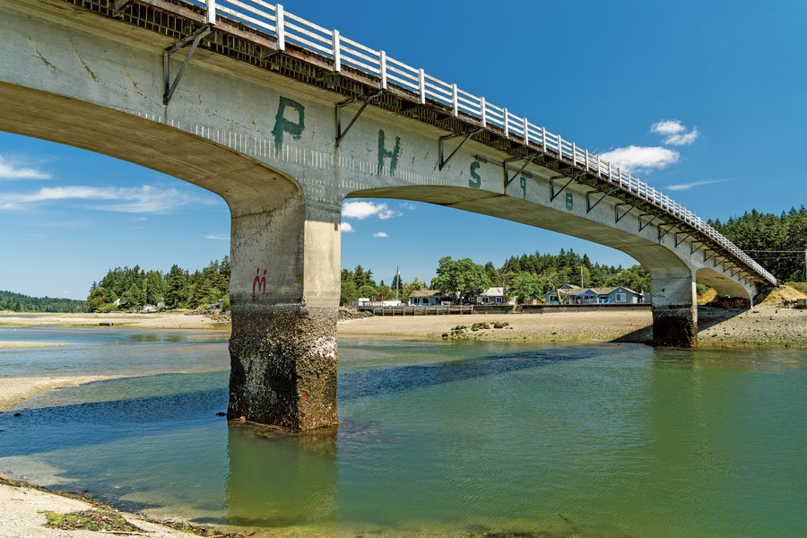 Built in 1936, the Purdy Bridge is graded as “poor condition” by WSDOT. Concrete pier deterioration seen here at low tide is slated for repair this summer.