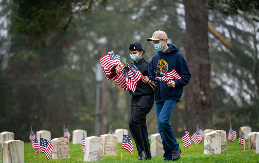 NJROTC students from Peninsula and Gig Harbor high schools honor fallen soldiers at Veterans Home Cemetery for Veterans Day.