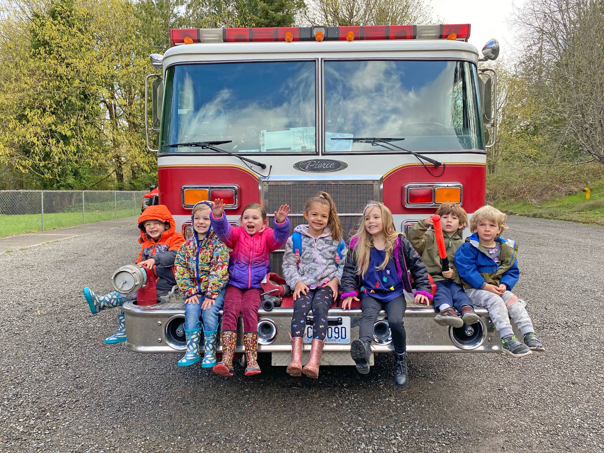 Peninsula Cooperative preschoolers consider the merits of firefighting as a career.
