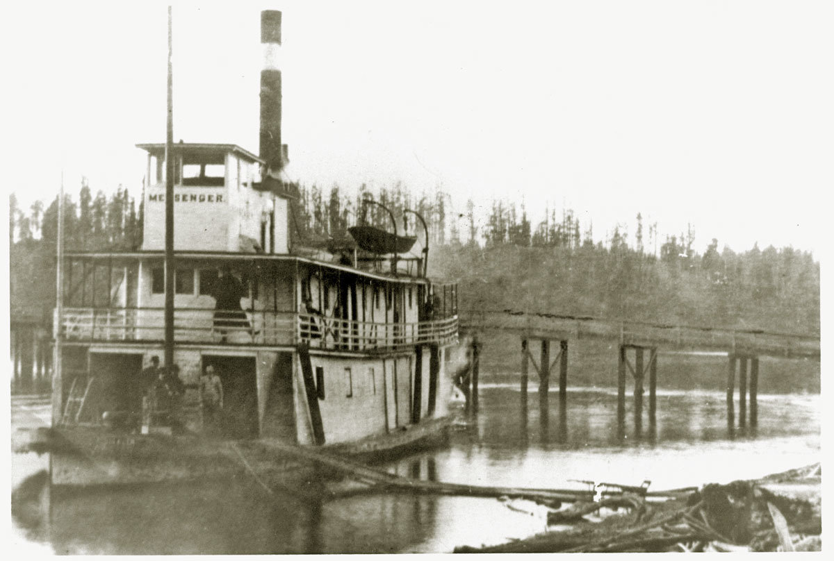 The steamboat Messenger anchored south of the east approach to the first bridge. The Messenger burned in 1894, dating the photo between 1892 and 1894.