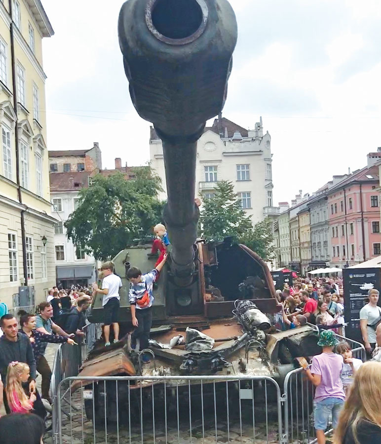 Children of Lviv playing on destroyed Russian tanks.