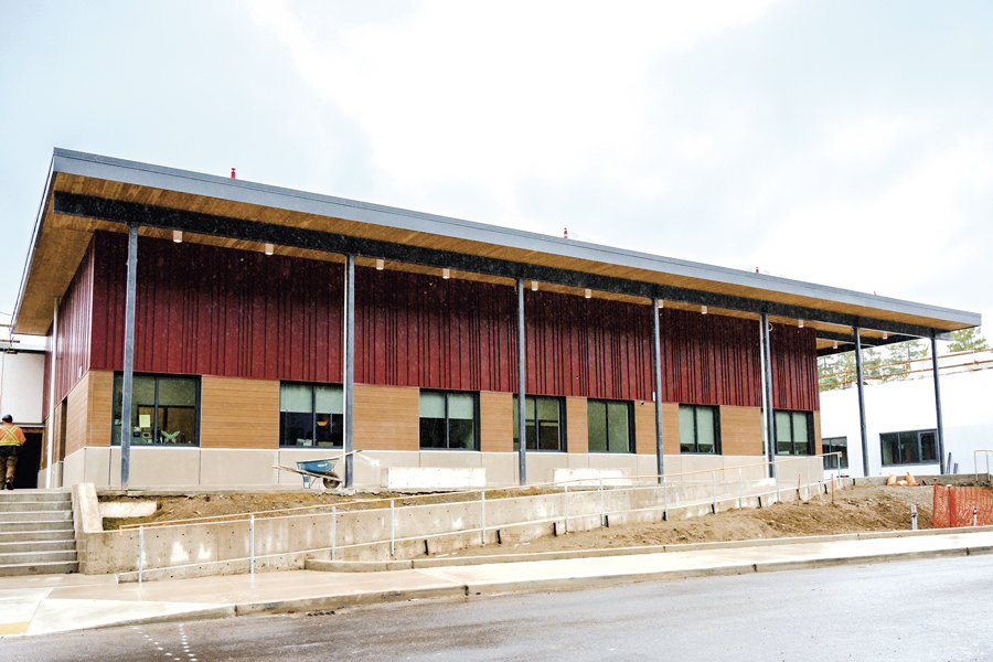 Exterior finish treatments on a portion of the modernized school building provide a glimpse of more to come