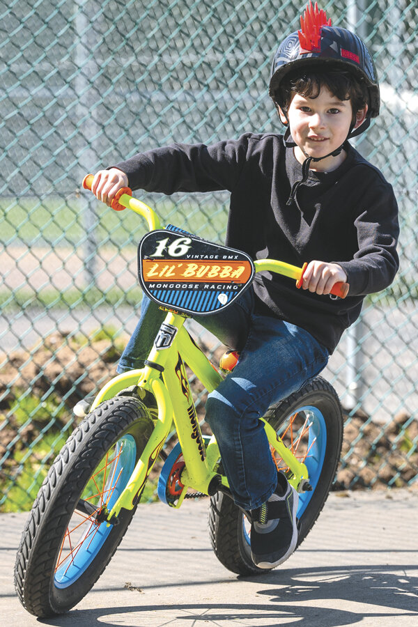 Grayson, age 7, rides at Volunteer Park during spring break.